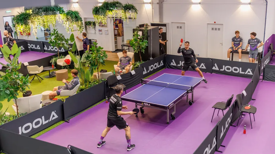 View from above: a team playing at a table next to the lounge