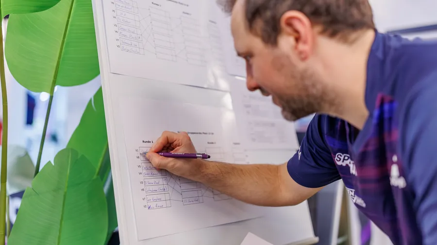 Tournament director entering results on the bracket